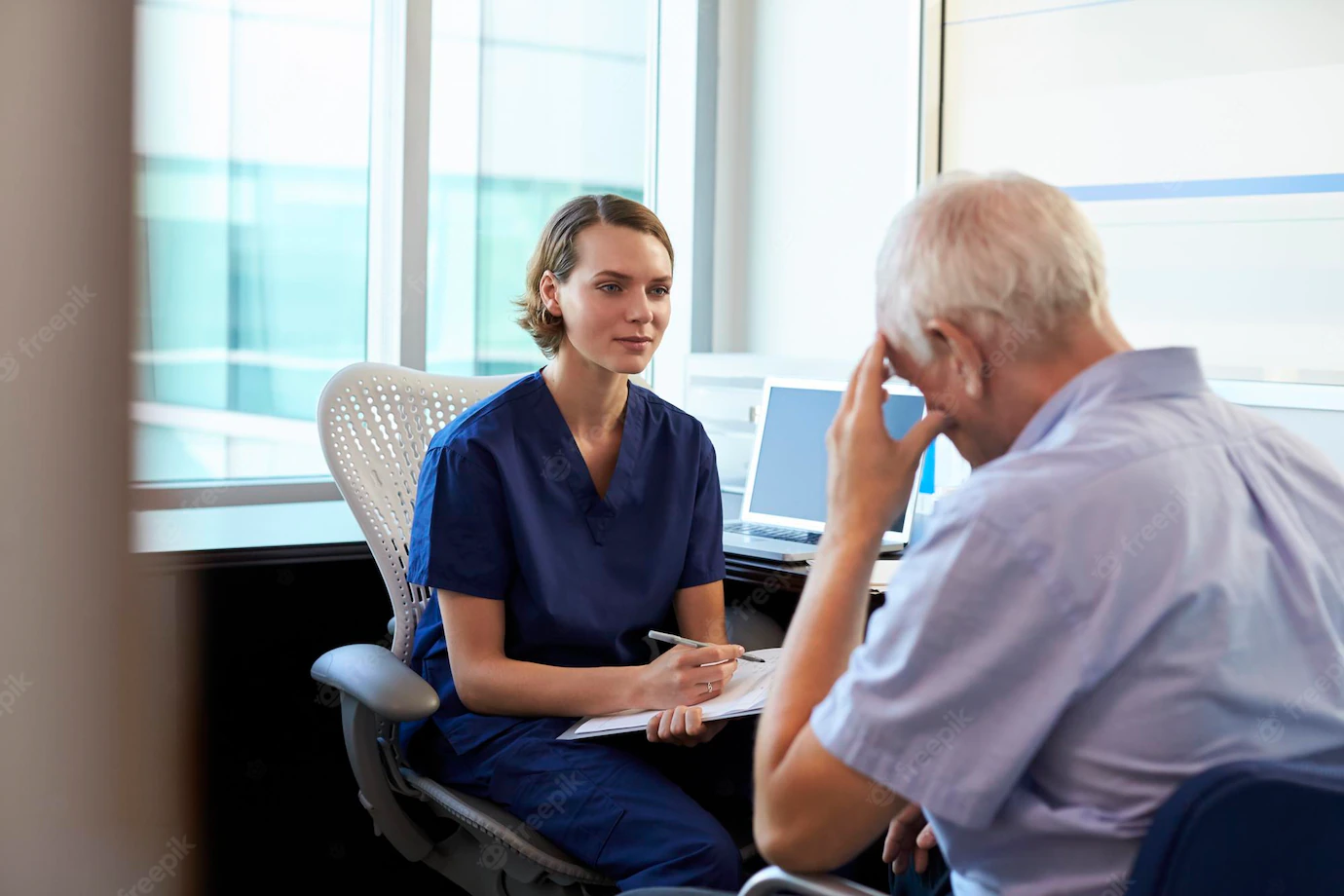 Image of a depressed male patient in consultation with his doctor